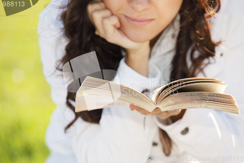 Image of Book in hands of woman