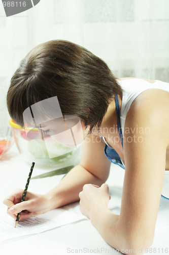 Image of Housewife making notes closeup