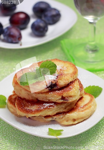 Image of Blinis (from white flour, with plum) on plate