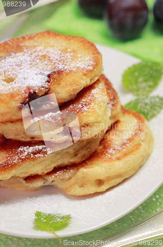 Image of Blinis (from white flour, with plum) on plate