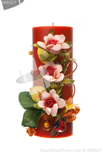 Image of Large red candle with the flower decoration