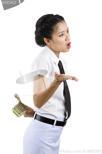 Image of businesswoman hiding money behind her back