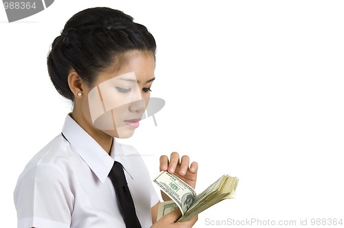 Image of businesswoman counting money