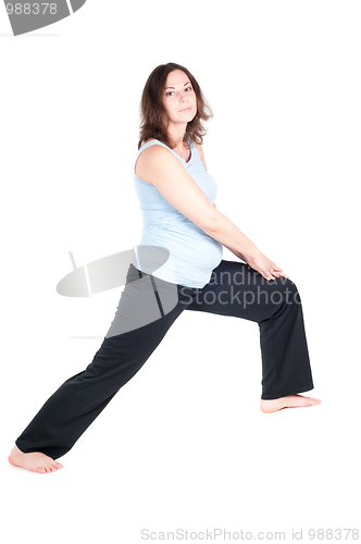 Image of Portrait of pretty pregnant woman practicing yoga