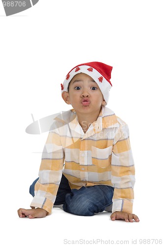 Image of boy with santa claus hat