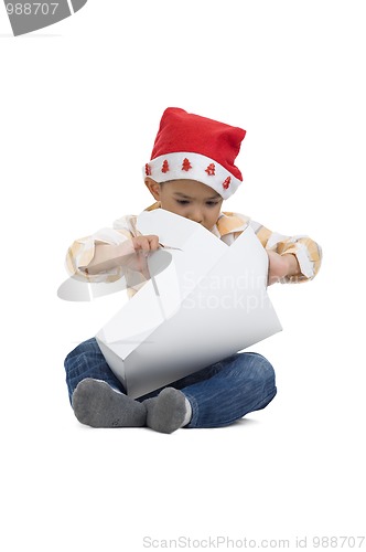 Image of boy opening christmas gift