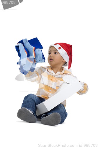 Image of boy opening christmas gift