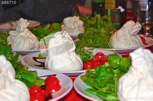 Image of Italian Burrata cheese with tomatoes and rocket