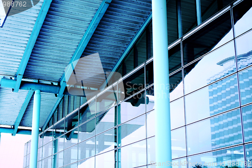 Image of modern blue glass wall of skyscraper