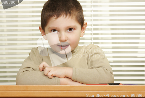 Image of Cute boy arms folded