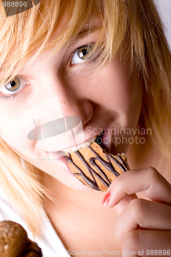 Image of woman eating chocolate chip cookies