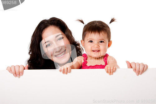 Image of Mother and baby daughter holding white board