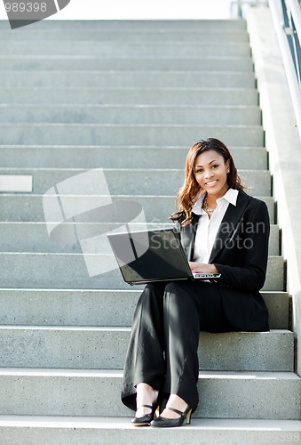 Image of Black businesswoman with laptop