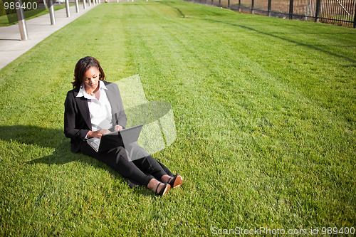 Image of Black businesswoman with laptop