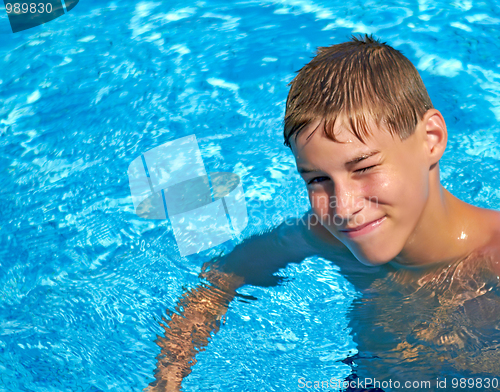 Image of Smiling boy bright water