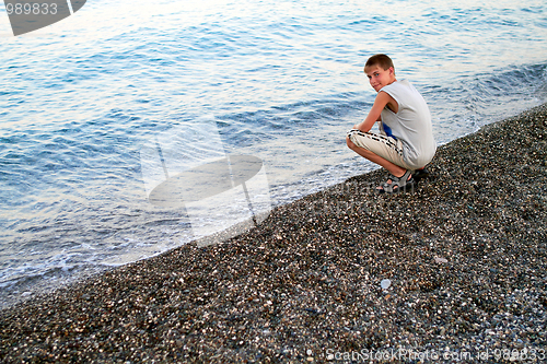 Image of Smiling boy at the beach