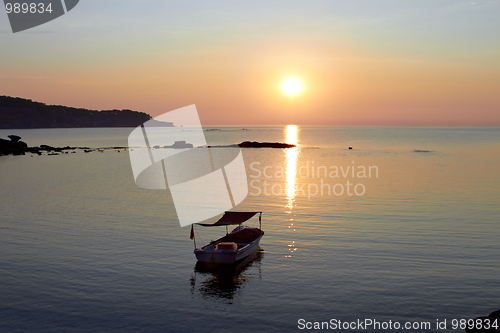 Image of Alone boat at sunset