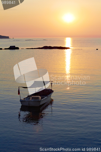 Image of Alone boat at sunset