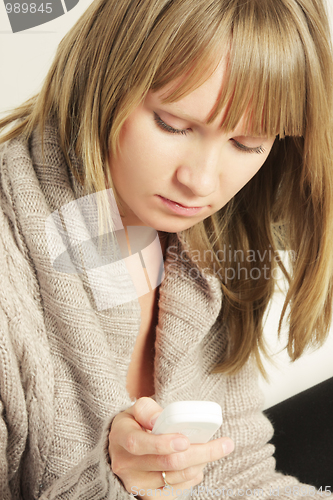Image of Woman with cellphone closeup