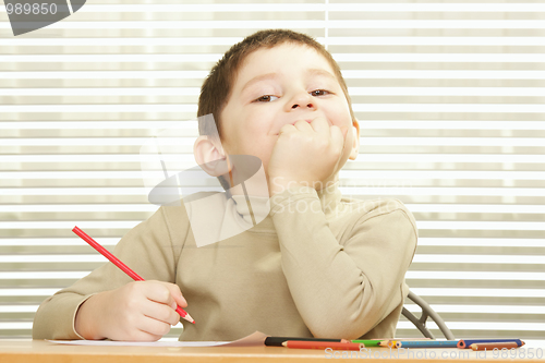 Image of Contented boy with crayon