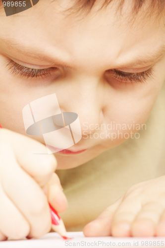 Image of Boy drawing closeup