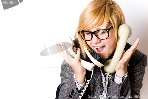 Image of businesswoman with three phones