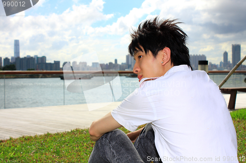 Image of portrait of a young business man in the park