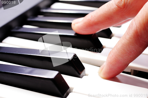 Image of hands playing music on the piano, hands and piano player, keyboa