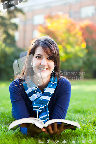 Image of Mixed race ollege student studying