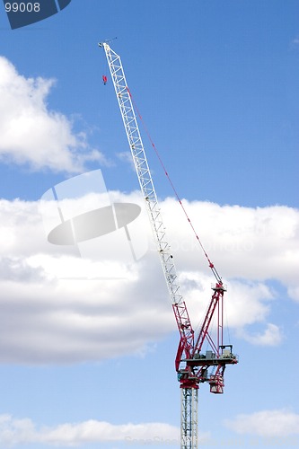 Image of Construction Site Crane with Clouds on the Background