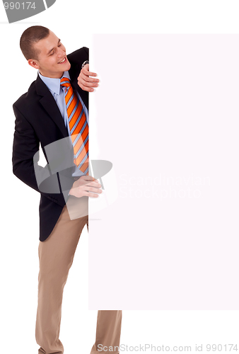 Image of Business man holding blank poster
