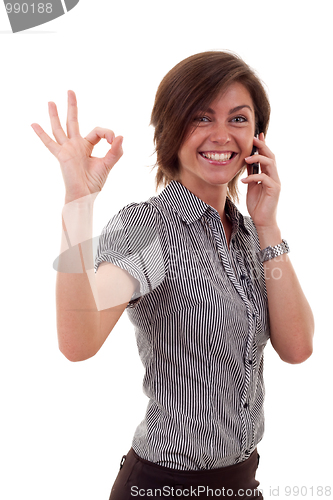 Image of woman with phone and ok gesture