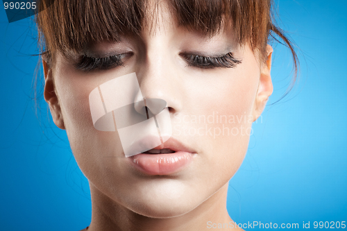 Image of woman looking downwards