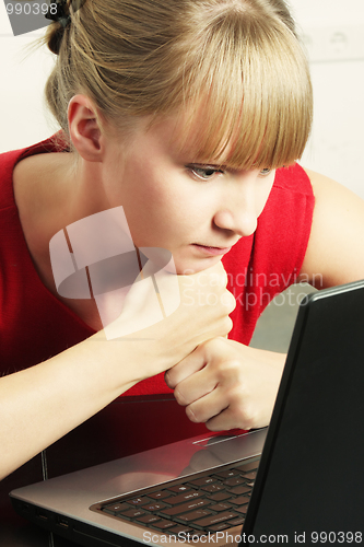 Image of Blonde businesswoman with laptop