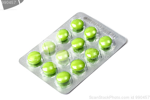 Image of Package of green pills isolated on white 