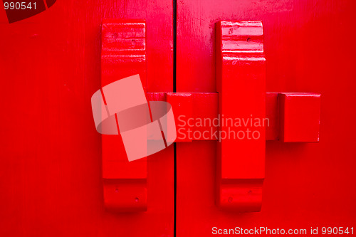 Image of Red door with wood lock 