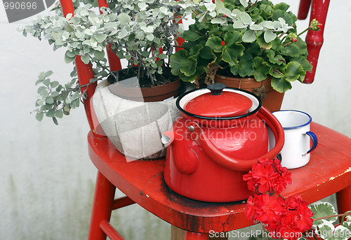 Image of Chair and with flowers on top