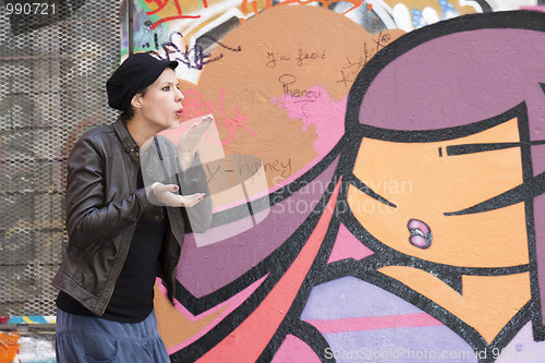 Image of woman blowing  in her hands