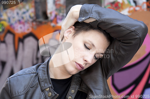 Image of  woman massaging head