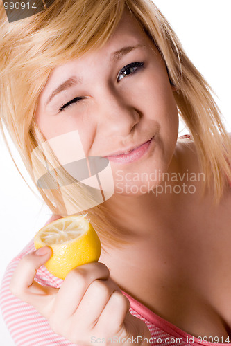 Image of young girl holding lemon