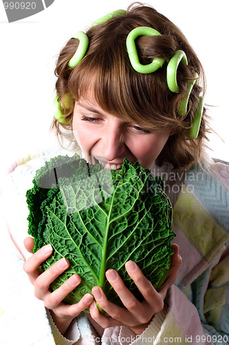 Image of woman with fresh savoy cabbage