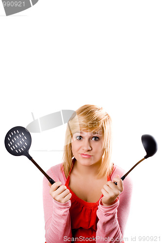 Image of young housewife with kitchen utensil