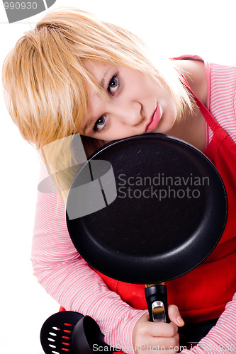 Image of sad housewife with pan