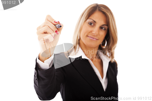 Image of businesswoman writing at a whiteboard