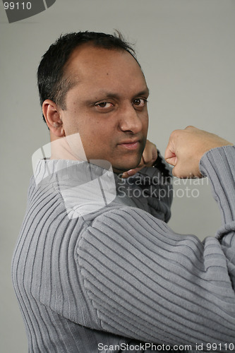 Image of man showing muscles