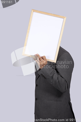 Image of businessman holding a whiteboard