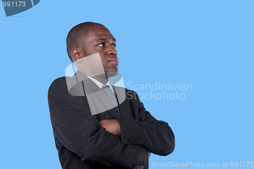 Image of African businessman with arms crossed