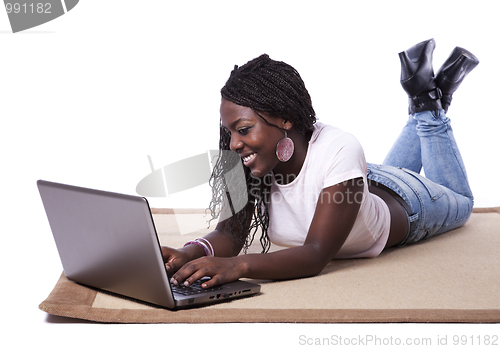 Image of young african woman working with her laptop