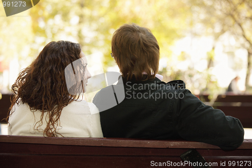 Image of Young couple in park rear view