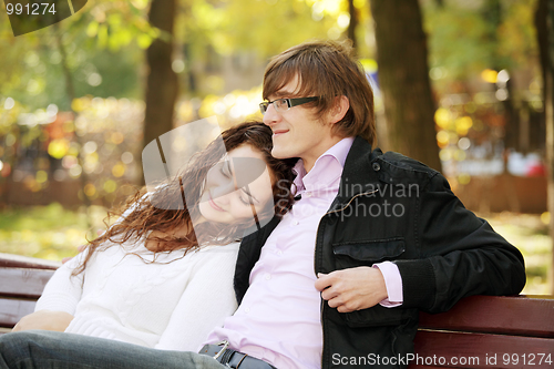 Image of Young serene couple in park